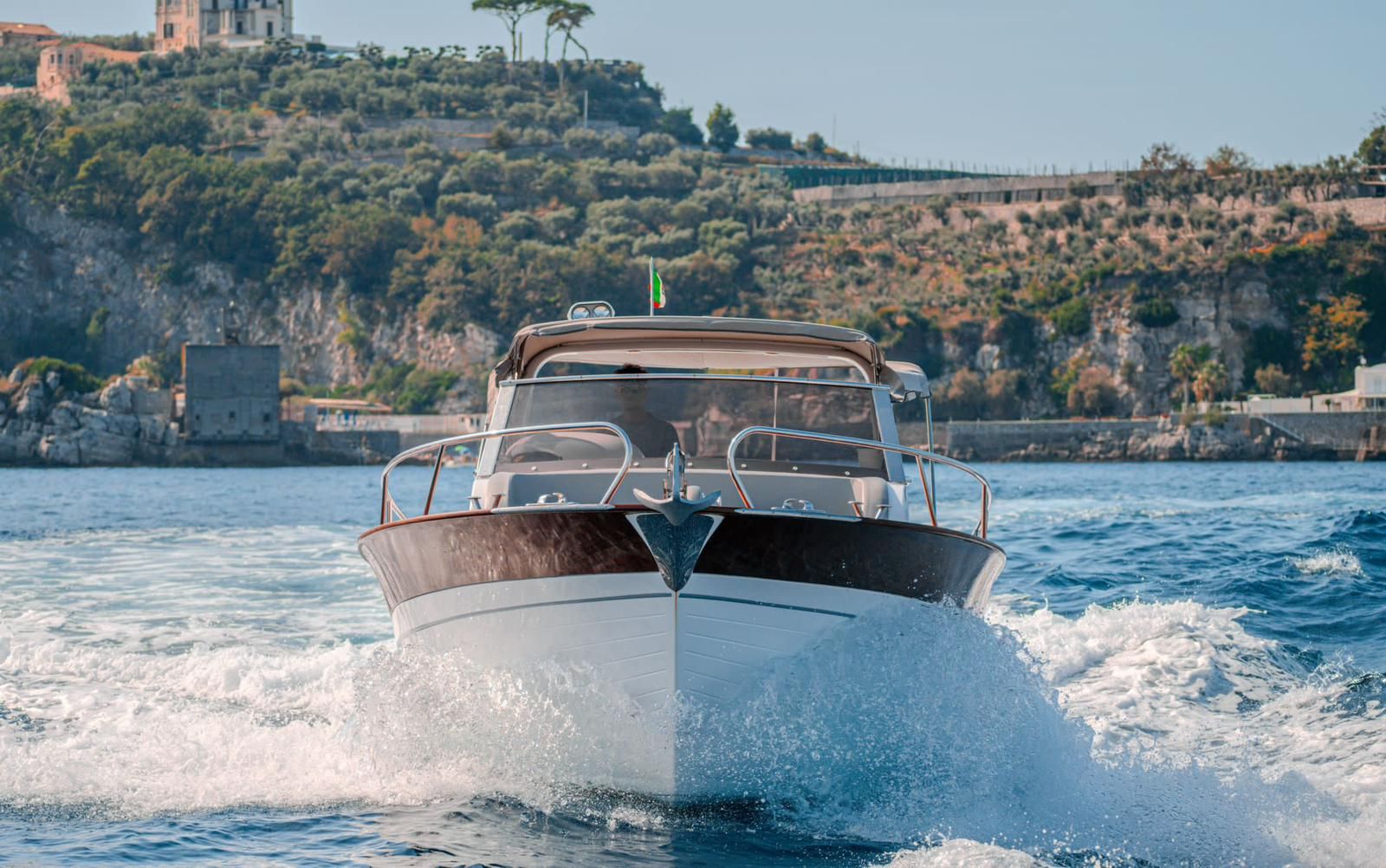 A traditional Sorrento gozzo cruising along the coast